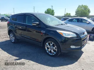 2013 Ford Escape SEL with VIN 1FMCU9H97DUA51529, listed as a IAAI auction lot 42164245 with 106,649 mi miles and . Bid and sale history available at carsss.com. Image 1.