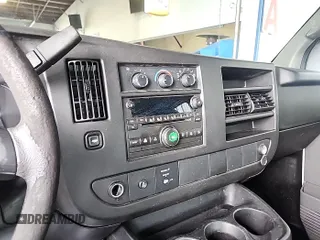 2013 Chevrolet Express Cargo Van with VIN 1GCWGFCA4D1137326, listed as a IAAI auction lot 42194387 with 214,260 mi miles. Bid and sale history available at carsss.com. Image 1.