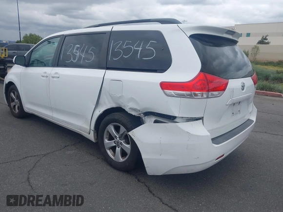 2012 Toyota Sienna LE AAS with VIN 5TDKK3DC4CS183817, listed as a IAAI auction lot 42013545 with 207,822 mi miles. Bid and sale history available at carsss.com. Image 3.