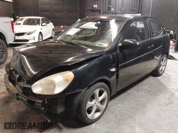 2007 Hyundai Accent SE with VIN KMHCN36C67U026540, listed as a IAAI auction lot 41062633 with 70,143 mi miles. Bid and sale history available at carsss.com. Image 19.