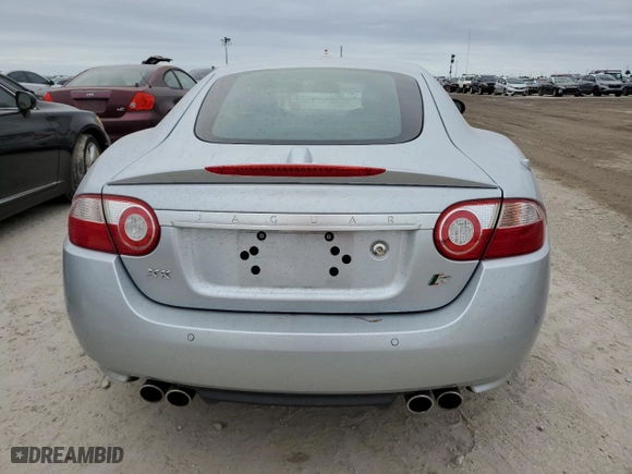 2007 Jaguar XK with VIN SAJWA43C979B19440, listed as a Copart auction lot 76762184 with 0 mi miles and Salvage Title. Bid and sale history available at carsss.com. Image 6.