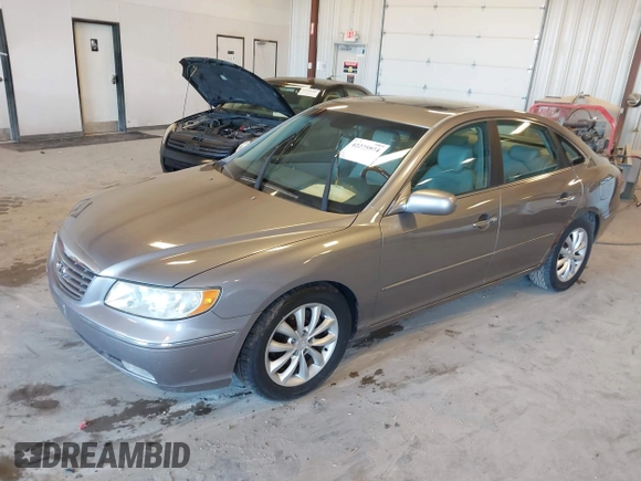 2007 Hyundai Azera SE z VIN KMHFC46F87A173110, wystawiony jako IAAI lot #42275974 z przebiegiem 208 901 mil mil oraz . Historia ofert i sprzedaży dostępna na DreamBid. Obrazek 2.