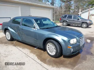 2005 Chrysler 300 with VIN 2C3JA43R45H616682, listed as a IAAI auction lot 41853835 with 158,464 mi miles. Bid and sale history available at carsss.com. Image 1.
