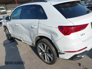 2021 Audi Q3 S line Premium z VIN WA1DECF35M1063868, wystawiony jako IAAI lot #42247128 z przebiegiem 89 959 mil mil oraz . Historia ofert i sprzedaży dostępna na DreamBid. Obrazek 17.