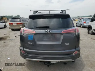 2016 Toyota RAV4 XLE with VIN 2T3RFREV0GW412875, listed as a Copart auction lot 59497545 with 226,604 mi miles and Salvage title. Bid and sale history available at DreamBid. Image 6.