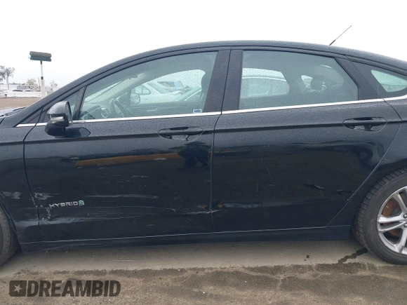2016 Ford Fusion SE Hybrid with VIN 3FA6P0LU5GR356433, listed as a IAAI auction lot 41799204 with 157,670 mi miles. Bid and sale history available at carsss.com. Image 14.