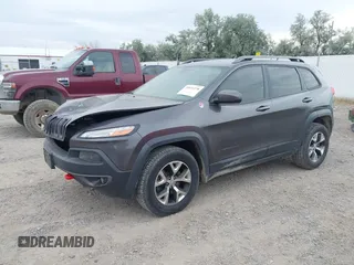 2015 Jeep Cherokee Trailhawk with VIN 1C4PJMBSXFW654754, listed as a IAAI auction lot 39935278 with 128,076 mi miles and . Bid and sale history available at DreamBid. Image 2.
