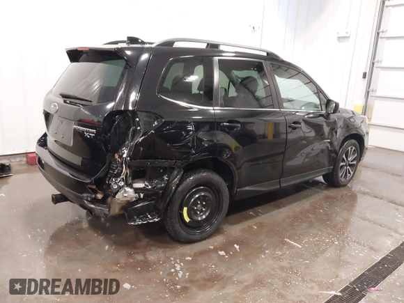 2017 Subaru Forester Premium with VIN JF2SJGEC9HH448561, listed as a IAAI auction lot 41776350 with 97,077 mi miles. Bid and sale history available at carsss.com. Image 4.