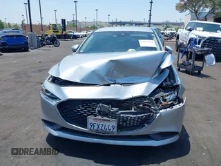 2020 Mazda 3 Select with VIN 3MZBPACL1LM131999, listed as a IAAI auction lot 42433532 with 23,067 mi miles and . Bid and sale history available at DreamBid. Image 13.