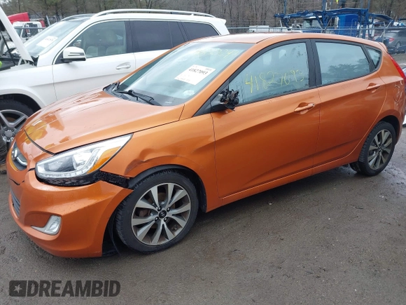 2015 Hyundai Accent Sport with VIN KMHCU5AE3FU205849, listed as a IAAI auction lot 41827093 with 112,980 mi miles. Bid and sale history available at carsss.com. Image 2.