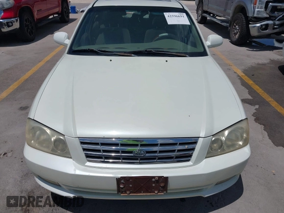 2002 Kia Optima LX z VIN KNAGD126325144218, wystawiony jako IAAI lot #42596691 z przebiegiem 220 972 mil mil oraz . Historia ofert i sprzedaży dostępna na DreamBid. Obrazek 6.