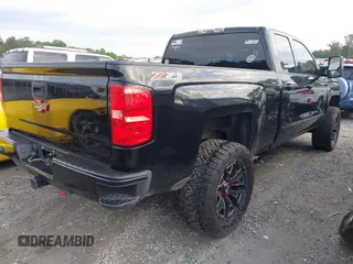 2017 Chevrolet Silverado 1500 LT with VIN 1GCVKREC1HZ197985, listed as a IAAI auction lot 42248714 with 142,123 mi miles and . Bid and sale history available at DreamBid. Image 4.