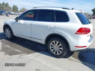2012 Volkswagen Touareg Sport with VIN WVGEF9BP5CD007294, listed as a IAAI auction lot 41841268 with 160,883 mi miles and . Bid and sale history available at DreamBid. Image 3.