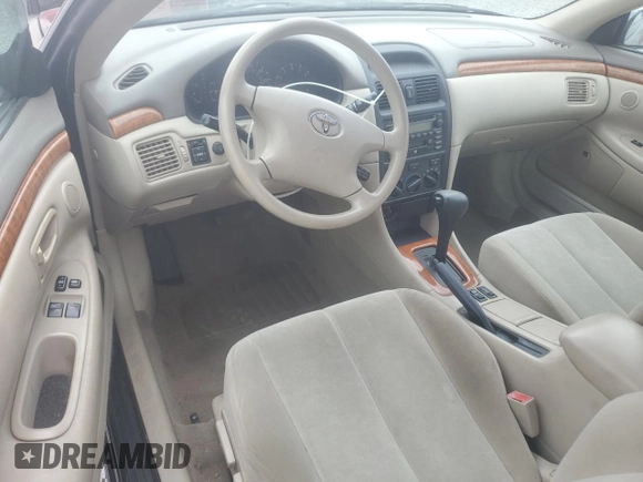 2002 Toyota Solara SE z VIN 2T1FE22P52C000697, wystawiony jako Copart lot #54598225 z przebiegiem 80 113 mil mil oraz Szkoda całkowita • Salvage title. Historia ofert i sprzedaży dostępna na DreamBid. Obrazek 8.