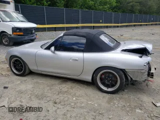 2004 Mazda MX-5 Miata LS with VIN JM1NB353640400140, listed as a Copart auction lot 56127165 with 123,276 mi miles and Salvage title. Bid and sale history available at DreamBid. Image 2.