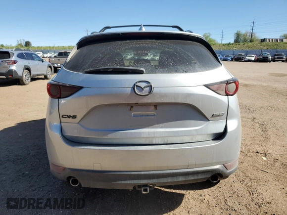 2019 Mazda CX-5 Grand Touring with VIN JM3KFADM6K0543888, listed as a Copart auction lot 56310785 with 112,737 mi miles and Salvage title. Bid and sale history available at DreamBid. Image 6.