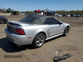 1999 Ford Mustang with VIN 1FAFP4448XF233101, listed as a Copart auction lot 54701005 with 54,585 mi miles and Salvage title. Bid and sale history available at DreamBid. Image 3.