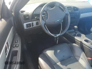 2002 Ford Thunderbird Hardtop Premium z VIN 1FAHP60A52Y115214, wystawiony jako Copart lot #70801894 z przebiegiem Nie podano mil oraz Szkoda całkowita • Salvage title. Historia ofert i sprzedaży dostępna na DreamBid. Obrazek 8.