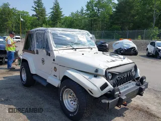 2002 Jeep Wrangler Sahara with VIN 1J4FA59S92P734763, listed as a IAAI auction lot 42411004 with 188,213 mi miles and . Bid and sale history available at DreamBid. Image 1.