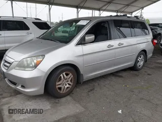 2007 Honda Odyssey EX with VIN 5FNRL38477B432832, listed as a IAAI auction lot 42153673 with 133,652 mi miles and . Bid and sale history available at DreamBid. Image 2.