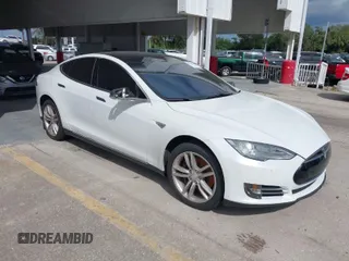 2014 Tesla Model S 60 with VIN 5YJSA1H16EFP51461, listed as a IAAI auction lot 40636898 with 90,762 mi miles and . Bid and sale history available at DreamBid. Image 1.