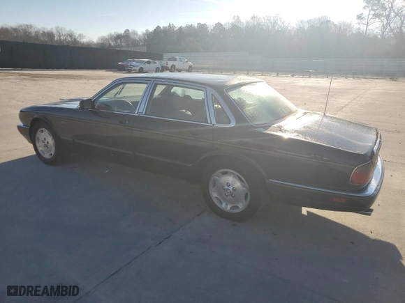 1997 Jaguar XJ with VIN SAJHX1245VC805665, listed as a Copart auction lot 45024125 with 0 mi miles and Salvage Title. Bid and sale history available at carsss.com. Image 2.