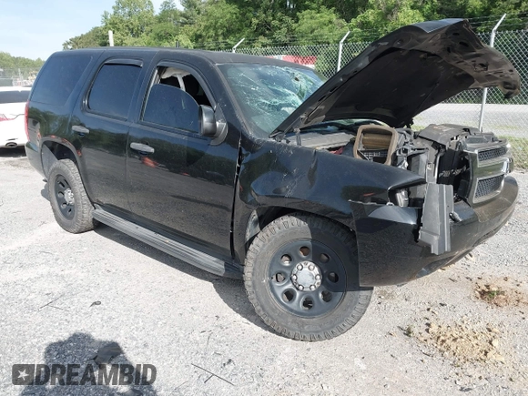 2013 Chevrolet Tahoe Commercial with VIN 1GNLC2E00DR265941, listed as a IAAI auction lot 42289977 with 206,840 mi miles and . Bid and sale history available at DreamBid. Image 1.
