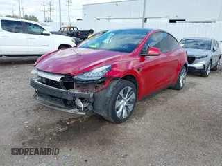 2020 Tesla Model Y Long Range with VIN 5YJYGDEE9LF009957, listed as a IAAI auction lot 41780248 with 31,053 mi miles and . Bid and sale history available at DreamBid. Image 2.