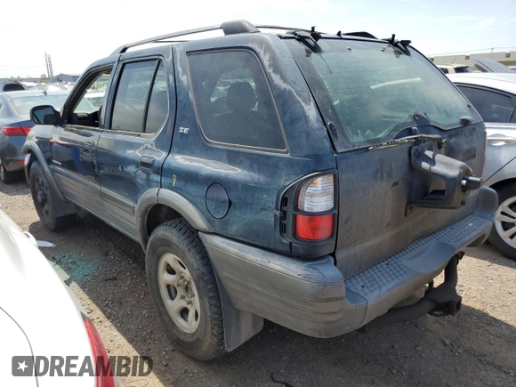 2001 Isuzu Rodeo S with VIN 4S2CK58W614344850, listed as a Copart auction lot 63807664 with 176,203 mi miles and Salvage title. Bid and sale history available at DreamBid. Image 2.