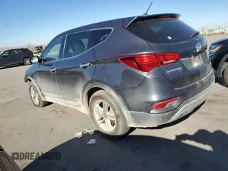 2018 Hyundai Santa Fe 2.4L z VIN 5XYZTDLB5JG568579, wystawiony jako Copart lot #82534794 z przebiegiem 130 032 mil mil oraz Szkoda całkowita • Salvage title. Historia ofert i sprzedaży dostępna na DreamBid. Obrazek 2.