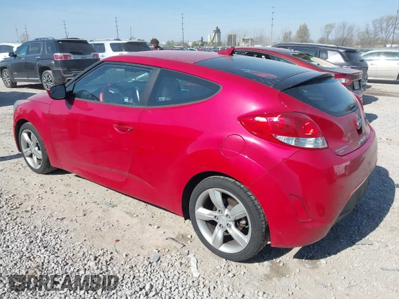 2014 Hyundai Veloster with VIN KMHTC6AD2EU214847, listed as a IAAI auction lot 42067728 with 77,421 mi miles. Bid and sale history available at carsss.com. Image 3.