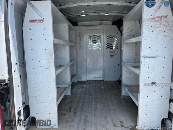 2021 Ford Transit Cargo with VIN 1FTYE1C87MKA94593, listed as a IAAI auction lot 42658954 with 99,425 mi miles and . Bid and sale history available at DreamBid. Image 3.