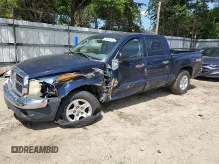 2005 Dodge Dakota SLT with VIN 1D7HW48N15S236117, listed as a Copart auction lot 57402675 with 154,303 mi miles and Salvage title. Bid and sale history available at DreamBid. Image 1.