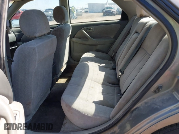 1998 Toyota Camry LE z VIN 4T1BG22K0WU352118, wystawiony jako IAAI lot #42066267 z przebiegiem 289 599 mil mil oraz . Historia ofert i sprzedaży dostępna na DreamBid. Obrazek 8.