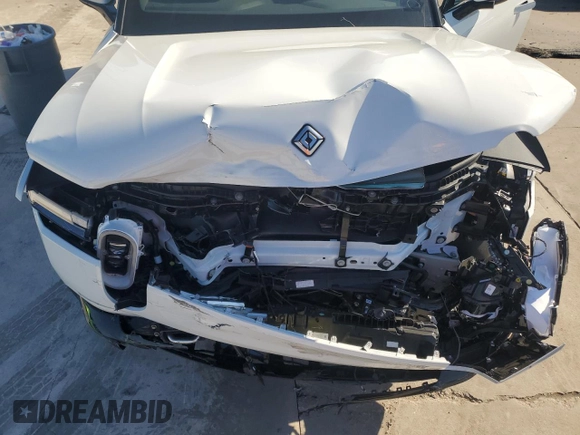 2025 Rivian R1S Adventure z VIN 7PDSGBBA3SN046975, wystawiony jako Copart lot #42880125 z przebiegiem Nie podano mil oraz Szkoda całkowita • Salvage title. Historia ofert i sprzedaży dostępna na DreamBid. Obrazek 11.
