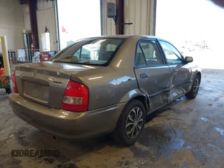 2000 Mazda Protege DX with VIN JM1BJ2225Y0278677, listed as a IAAI auction lot 42056816 with 188,552 mi miles and . Bid and sale history available at DreamBid. Image 4.