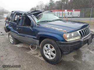 2002 Jeep Grand Cherokee Laredo with VIN 1J4GW48S82C321712, listed as a IAAI auction lot 41855809 with 1 mi miles. Bid and sale history available at carsss.com. Image 1.