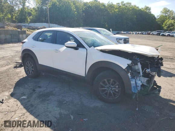 2023 Mazda CX-30 S with VIN 3MVDMBAM0PM506565, listed as a Copart auction lot 57699125 with 7,345 mi miles and Salvage title. Bid and sale history available at DreamBid. Image 4.