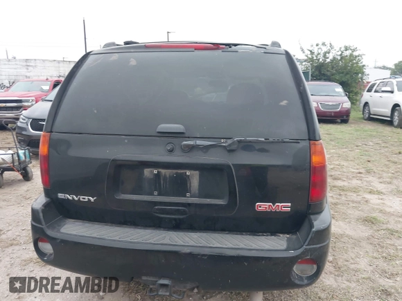 2006 GMC Envoy SLT with VIN 1GKDS13S462241866, listed as a IAAI auction lot 41943322 with 90,695 mi miles. Bid and sale history available at carsss.com. Image 16.