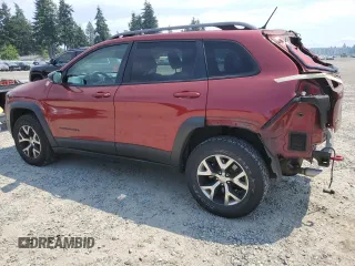 2015 Jeep Cherokee Trailhawk with VIN 1C4PJMBSXFW661218, listed as a Copart auction lot 61364895 with 139,200 mi miles and Salvage title. Bid and sale history available at DreamBid. Image 2.