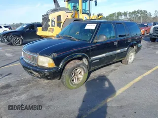 1998 GMC Jimmy SLT with VIN 1GKDT13W5W2502521, listed as a IAAI auction lot 41579741 with 176,802 mi miles. Bid and sale history available at carsss.com. Image 2.