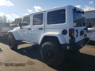 2018 Jeep Wrangler JK Unlimited Sport S with VIN 1C4BJWDG2JL913150, listed as a Copart auction lot 79956974 with 86,153 mi miles and Salvage Title. Bid and sale history available at carsss.com. Image 2.