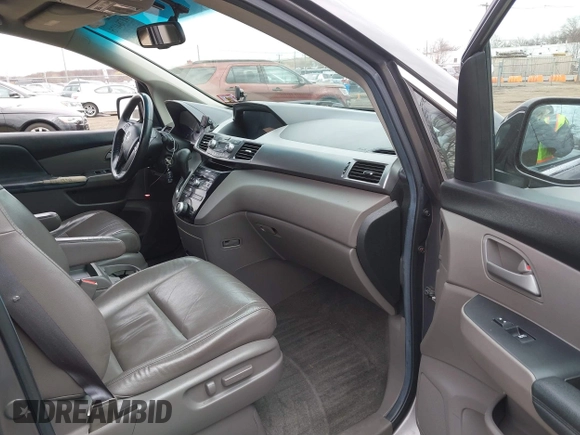 2012 Honda Odyssey EX-L with VIN 5FNRL5H65CB042898, listed as a IAAI auction lot 41784075 with 179,596 mi miles and . Bid and sale history available at carsss.com. Image 5.