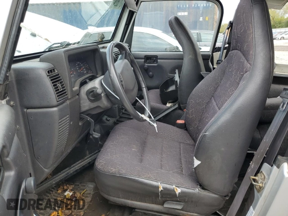 2002 Jeep Wrangler Sport with VIN 1J4FA49S32P733909, listed as a Copart auction lot 72776204 with 157,508 mi miles and Non Repairable. Bid and sale history available at carsss.com. Image 7.
