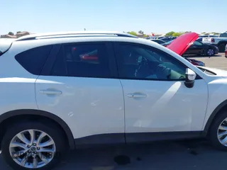 2015 Mazda CX-5 Grand Touring with VIN JM3KE2DYXF0493370, listed as a IAAI auction lot 42087156 with 161,464 mi miles. Bid and sale history available at carsss.com. Image 13.