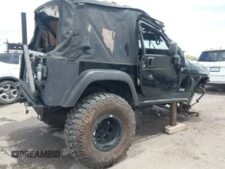 2004 Jeep Wrangler Rubicon z VIN 1J4FA69S84P727716, wystawiony jako IAAI lot #42162129 z przebiegiem 90 844 mil mil oraz . Historia ofert i sprzedaży dostępna na DreamBid. Obrazek 4.