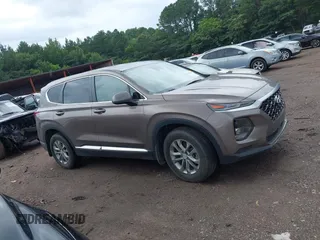 2020 Hyundai Santa Fe SE with VIN 5NMS23AD4LH142202, listed as a IAAI auction lot 42526020 with 59,964 mi miles and . Bid and sale history available at DreamBid. Image 13.