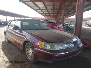 1998 Lincoln Town Car Signature with VIN 1LNFM82W2WY608803, listed as a IAAI auction lot 41743880 with 87,534 mi miles and . Bid and sale history available at DreamBid. Image 1.