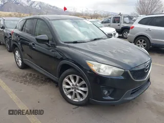 2013 Mazda CX-5 Grand Touring with VIN JM3KE4DEXD0154638, listed as a IAAI auction lot 41528944 with 195,159 mi miles. Bid and sale history available at carsss.com. Image 1.