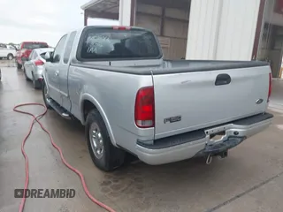2003 Ford F-150 XL with VIN 2FTRX17223CA73626, listed as a IAAI auction lot 42027926 with 127,614 mi miles. Bid and sale history available at carsss.com. Image 3.